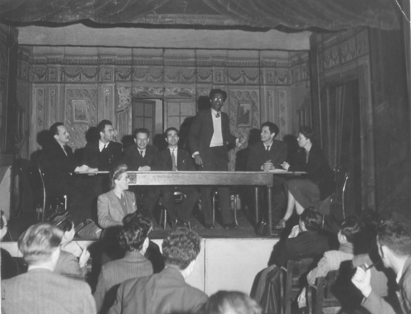 International meeting in Paris, 1946. Colin de Silva speaking. To his right are Jock Haston and Pierre Frank.