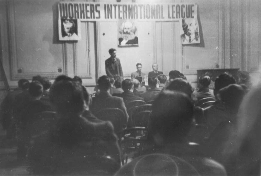 W.I.L. public meeting, Conway Hall, London. Ajit Roy speaking, Harold Atkinson and Gerry Healy seated.